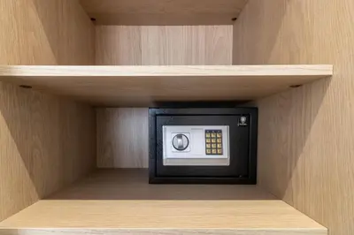 a small microwave in a corner of a shelf at Elegant Business Stay in Downtown Casablanca in Casablanca