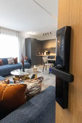 a door with a television in a living room at Elegant Business Stay in Downtown Casablanca in Casablanca