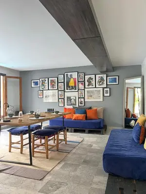 a living room with a blue couch and a table at stay in villa casablanca in Casablanca