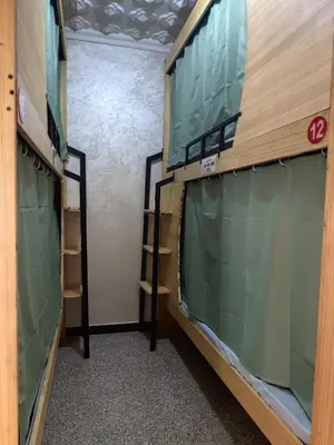 a room with two sets of glass doors and shelves at \u9526\u9ca4JinLi Voyageur in Casablanca