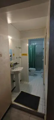 a bathroom with a sink and a toilet and a shower at \u9526\u9ca4JinLi Voyageur in Casablanca