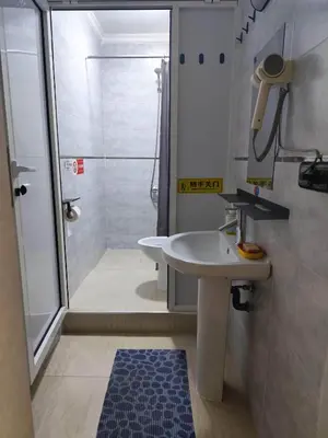 a bathroom with a sink and a shower at \u9526\u9ca4JinLi Voyageur in Casablanca