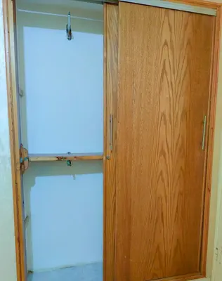 a closet with a wooden door and two windows at \u9526\u9ca4JinLi Voyageur in Casablanca