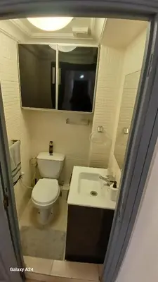 a small bathroom with a toilet and a sink at Bel Appartement au cœur de Casablanca in Casablanca
