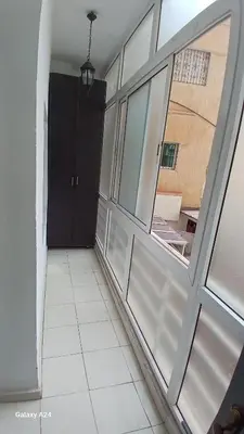 an empty room with a door and a window at Bel Appartement au cœur de Casablanca in Casablanca