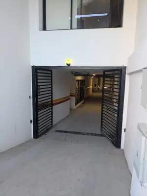 an empty hallway with a door in a building at My Cosy Place Cosy Apartment Casa gare Oasis in LʼOasis
