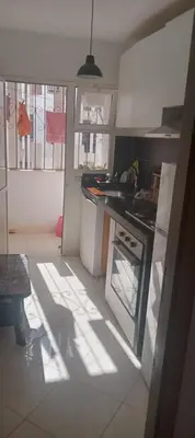 a kitchen with a sink and a stove top oven at Cosy studio dar bouazza in Casablanca