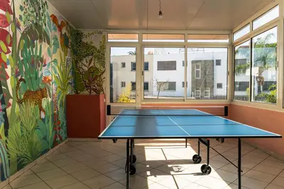 a room with a ping pong table in it at Upper floor of a villa, Modern and bright in Rabat