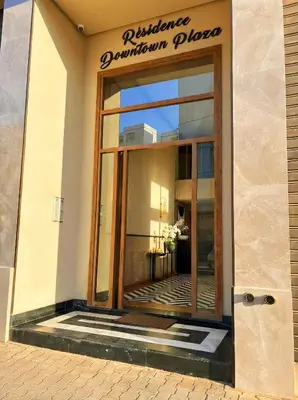 a building with a window with a sign on it at Maya Suites - Mohamed V Stadium - Casablanca in Casablanca