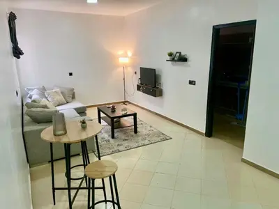 a living room with a couch and a table at Le bon coin in Casablanca