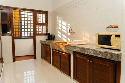 a kitchen with a counter top with a microwave at Large 2 bedroom apartment in prime location - 2 Balconies & private Parking in Rabat