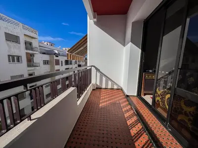 a balcony with a view of a building at Large 2 bedroom apartment in prime location - 2 Balconies & private Parking in Rabat