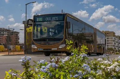 a bus is driving down a street at Green Nest, Loft with private garden-Free Parking- Fast WiFi- Netflix in Casablanca