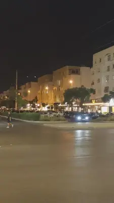 a person walking in a parking lot at night at Appartement a Oulad Mtaa ,Prés du stade Moulay Abdallah,Rabat in Rabat