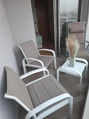 a group of chairs and a table in a room at Studio luxueux CFC in Casablanca