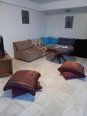 a living room with a couch and a table at BK anfa in Casablanca