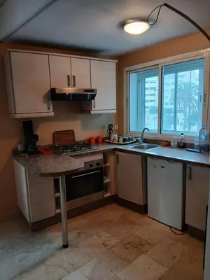 a kitchen with a sink and a stove top oven at BK anfa in Casablanca