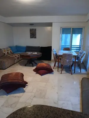 a living room with a couch and a table at BK anfa in Casablanca