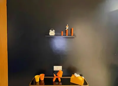 a shelf with shoes and orange objects on a wall at Maya Suites - B LIVING CFC in Casablanca
