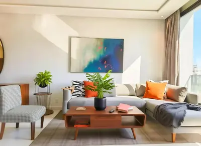 a living room with a couch and a table at Maya Suites - B LIVING CFC in Casablanca