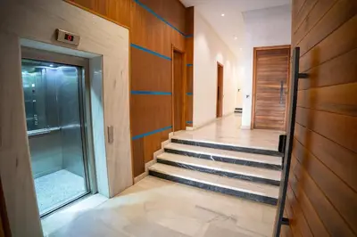 a hallway with stairs and a glass door at Downtown Private terrace in Casablanca