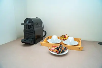 a toy table with three plates and a coffee maker at Downtown Private terrace in Casablanca