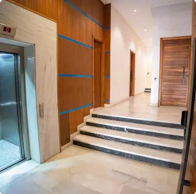 a staircase in a building with blue lines on the wall at Stay Here In Casablanca Center in Oulad Akkou