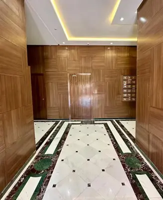a lobby with wooden walls and a tile floor at Appartement luxueux &chaleureux Agdal rabat in Rabat