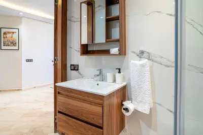 a bathroom with a sink and a shower at Appartement luxueux &chaleureux Agdal rabat in Rabat