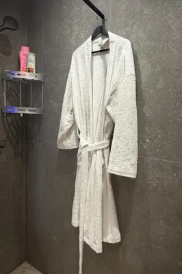 a robe hanging on a wall in a bathroom at Premium Business Suite Heart of Casablanca in Casablanca