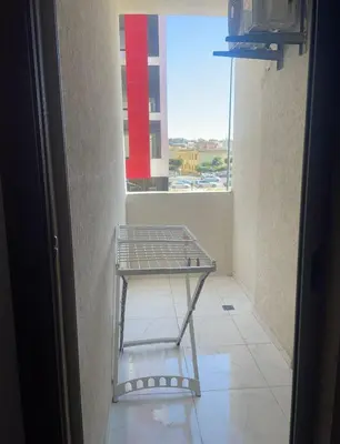 a metal shelf in a room with a window at Résidence Picasso in Casablanca