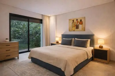 a bedroom with a large bed and a large window at Ain Diab , Luxury El amri in Casablanca
