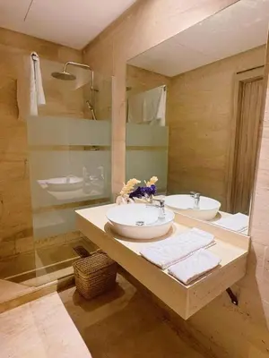 a bathroom with a sink and a mirror at Ain Diab , Luxury El amri in Casablanca