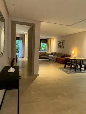a living room with a couch and a table at Ain Diab , Luxury El amri in Casablanca