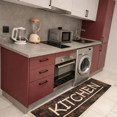 a kitchen with a washing machine and a microwave at EDEN Palmier in Casablanca