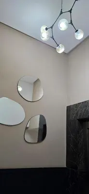 a bathroom with three mirrors on the wall at EDEN Palmier in Casablanca