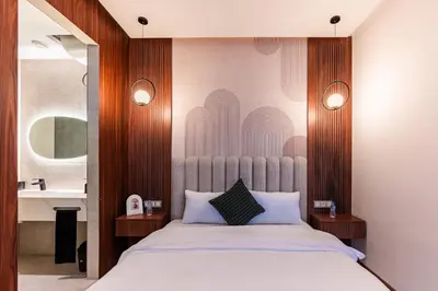 a bedroom with a large bed with wooden walls at New Architect & Design Studio - CFC & Maarif in Casablanca