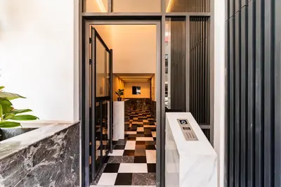 a hallway with a black and white checkered floor at New Architect & Design Studio - CFC & Maarif in Casablanca