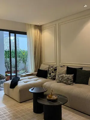 a living room with a couch and a table at New Architect & Design Studio - CFC & Maarif in Casablanca