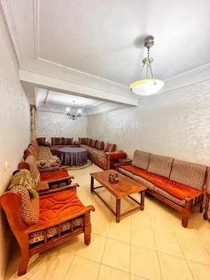 a living room with couches and tables at La Gironde, Families & Friends stay in comfort in Casablanca