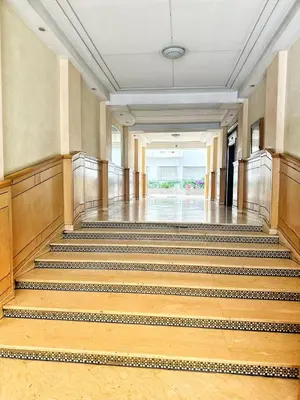 an empty hallway with stairs in a building at La Gironde, Families & Friends stay in comfort in Casablanca