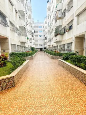 a walkway in a large apartment building at La Gironde, Families & Friends stay in comfort in Casablanca