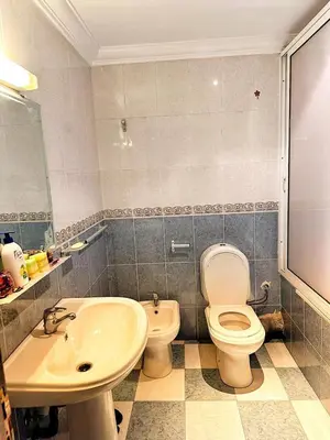 a bathroom with a toilet and a sink at La Gironde, Families & Friends stay in comfort in Casablanca