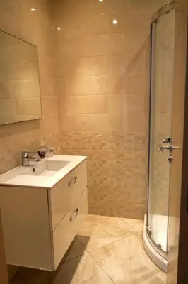 a bathroom with a sink and a shower at appartement with piscine & jardins - Détente à Bouznika, Rabat in Bouznika