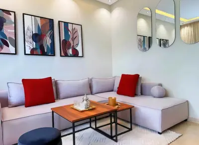a living room with a couch and a table at Maya Suites - Premium Stay - Racine in Casablanca