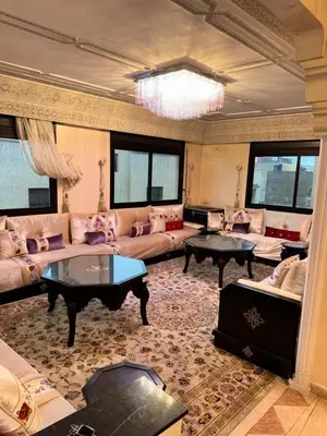 a large living room with couches and tables at Ideal appartement CAN2025 Grand Stade Rabat in Temara