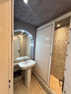 a bathroom with a sink and a mirror at Sympa appartement corniche in Casablanca