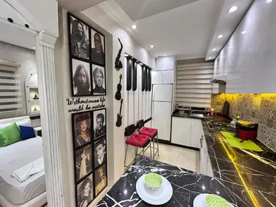 a kitchen with a table in a room at Sympa appartement corniche in Casablanca