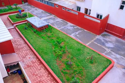 an aerial view of a building with a yard at CAN Comfort 2 Bedrooms in Temara