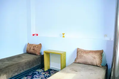 a room with two couches and a table and a window at CAN Comfort 2 Bedrooms in Temara